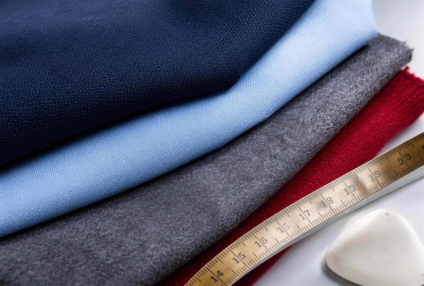 Fabric swatches and tailoring tools used to specify a school uniform order